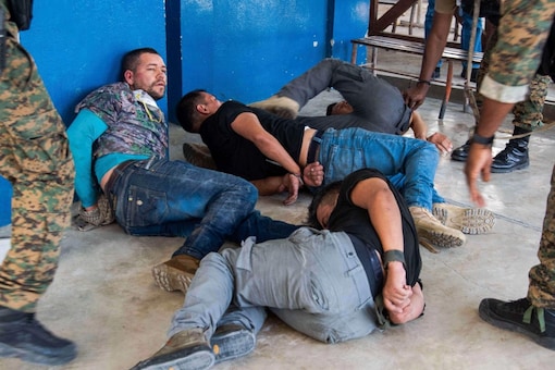 Suspects in the assassination of Haiti's President Jovenel Moise are tossed on the floor after being detained, at the General Direction of the police in Port-au-Prince, Haiti, on July 8, 2021. (Image: AP file)
