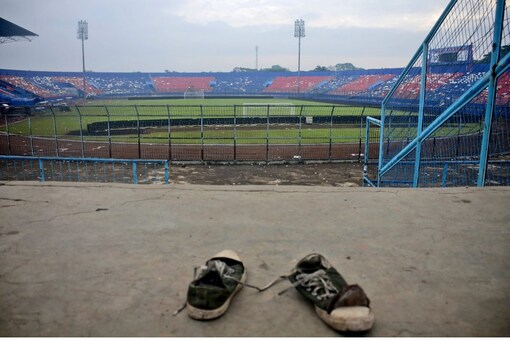 A pair of sneakers sit trampled in the stands of Kanjuruhan Stadium following a deadly soccer match stampede, in Malang, East Java, Indonesia, on Sunday. (Image: AP)
