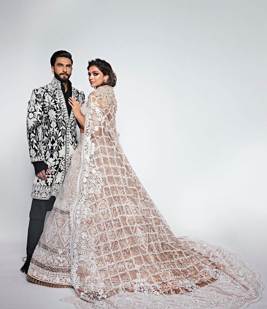 DEEPIKA PADUKONE: Deepika Padukone looked regal in this ethereal and elegant soft taupe lehenga choli with intricate designs and chikankari craft and paired it with a theatrical cape. She opted for bold eyes and glam makeup. For your festive look, you can chuck the cape and opt for a sheer chikankari dupatta. (Image: Instagram)