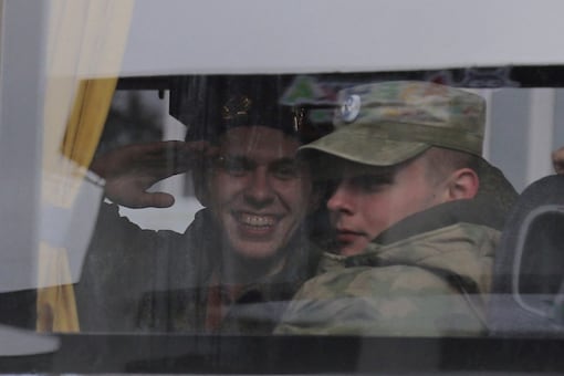 Russian reservists look through a bus window during their departure for a base in the course of partial mobilisation of troops, aimed to support the country's military campaign in Ukraine (Reuters Photo)