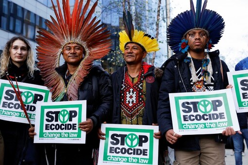 People take part in a protest against climate change called EU Council stop Ecocide now. (File Photo: Reuters)