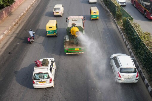 An anti-smog gun being used to spray water droplets to curb air pollution, in New Delhi (PTI Photo)