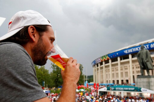 A fan drinks a beer at the Luzhniki Stadium during 2018 FIFA World Cup (AP)