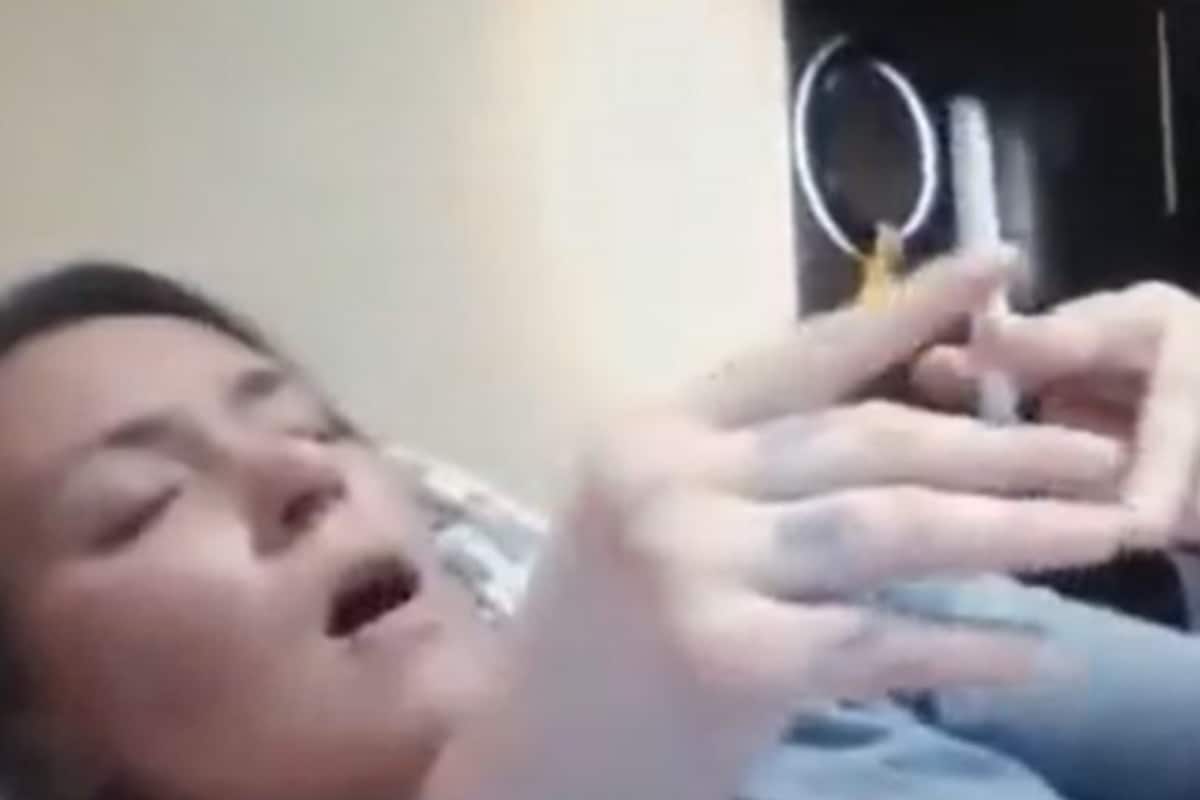 Judge Polania lights a cigarette in bed during her Zoom callVivian Polania smoking and lounging during her official dutyVivian Polania's relaxed posture during the court hearing