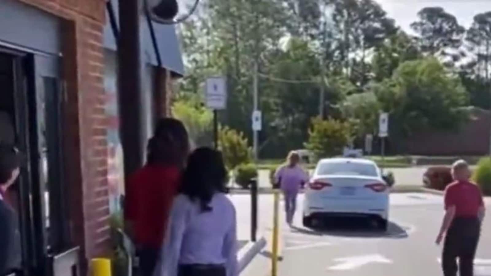 WATCH: Woman Rushes Out of Car to Talk to Drive-Thru Employee, Vehicle ...
