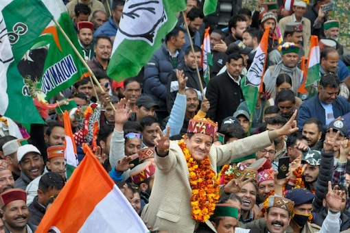 Congress candidate Sunder Singh Thakur celebrates his win with supporters in Kullu (PTI Photo)