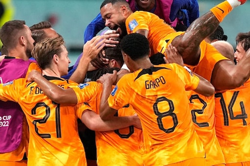 Players of the Netherlands celebrate their side's second goal by Daley Blind during the World Cup round of 16 soccer match between the Netherlands and the United States, at the Khalifa International Stadium in Doha, Qatar, Saturday, Dec. 3, 2022. (AP Photo/Martin Meissner)
