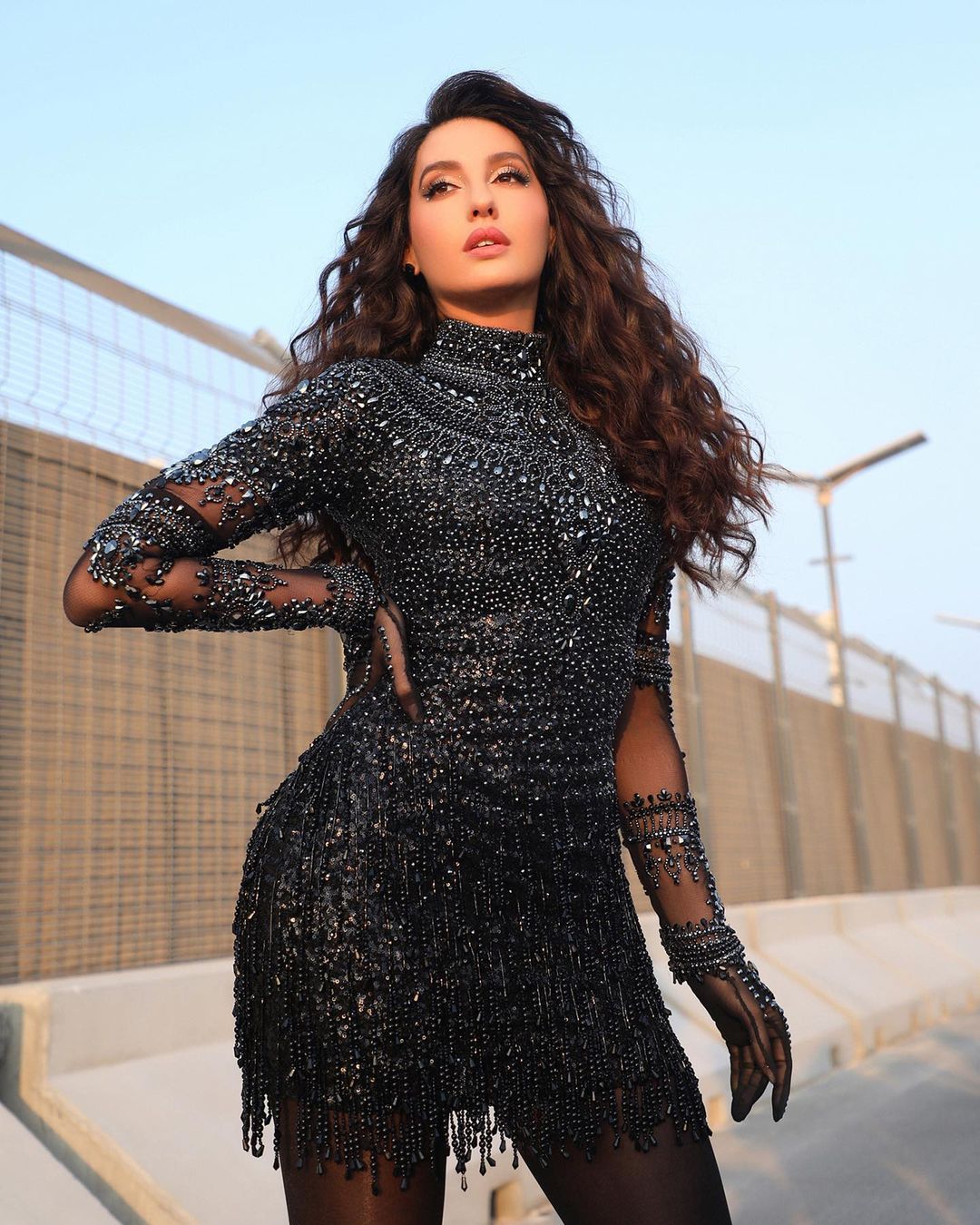 Nora Fatehi dazzled in a sparkly black outfit for her World Cup performance. 