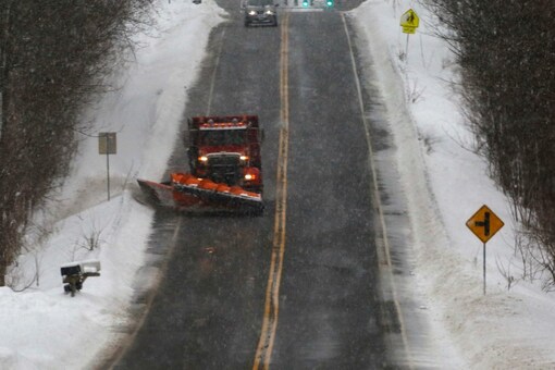 A snow plough travels down a stretch of open highway, working on the side roads following a deadly Christmas blizzard, in Elma, New York, US (Image: Reuters)