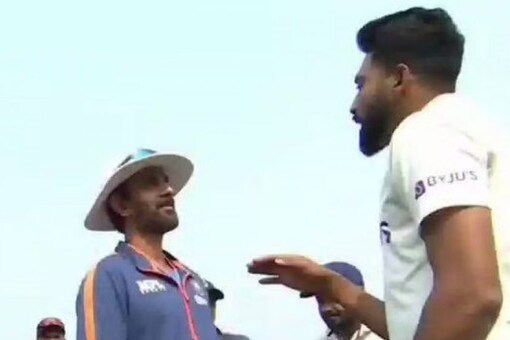 Mohammed Siraj and batting coach engaged in a friendly banter.