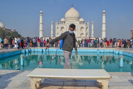 Tourists in large numbers visit Taj Mahal on Christmas, in Agra. (PTI Photo)