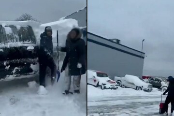 Buffalo Bills players dig out cars buried in snow 