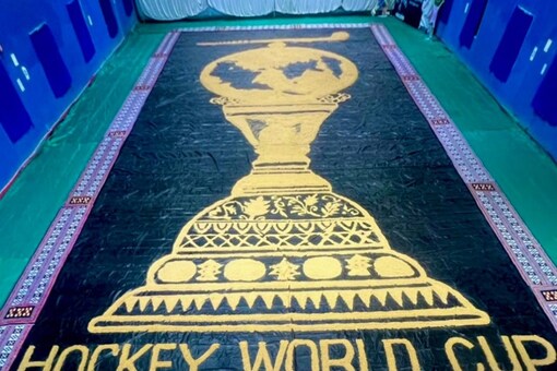 Hockey World Cup: Sudarsan creates rice husk mosaic art of trophy to cheer Indian team (IANS)