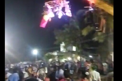 The video showed people in a state of frenzy as the crane suddenly collapsed (Source: News18)