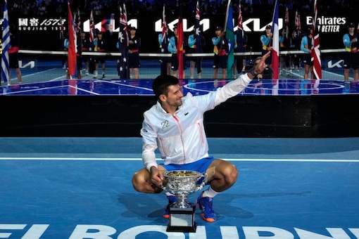 Novak Djokovic of Serbia poses with the Norman Brookes Challenge Cup after defeating Stefanos Tsitsipas of Greece in the men's singles final at the Australian Open tennis championship in Melbourne, Australia, Sunday, Jan. 29, 2023. (AP Photo/Aaron Favila)