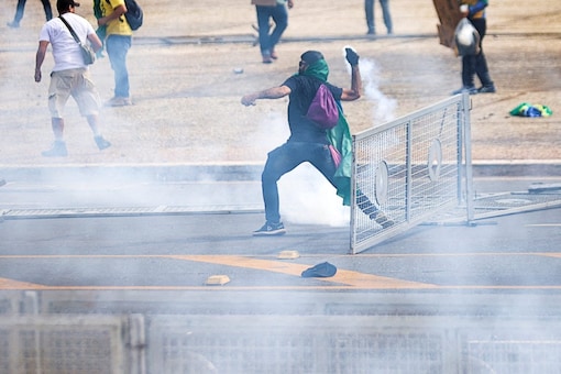 Supporters of Brazil's former President Jair Bolsonaro demonstrate against President Luiz Inacio Lula da Silva, outside Brazil’s National Congress in Brasilia, Brazil (Image: Reuters)