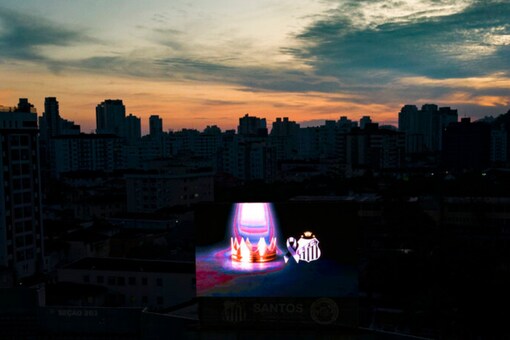 A crown displayed on a TV screen at Vila Belmiro stadium where Pele, the late Brazilian football great lies in state in Santos, Brazil (AP)