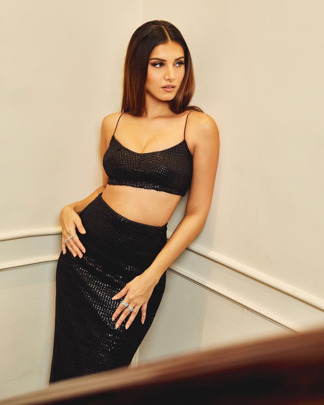 Tara Sutaria looks gorgeous in a black bralette and sequin skirt.