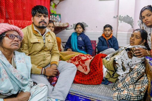 Family members of Anjali Singh who was killed after being hit and dragged by a car, at Sultanpuri in New Delhi, on Wednesday. (PTI) 