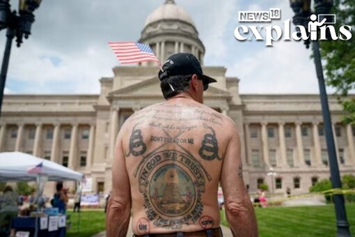 A gun rights supporter listens to a speaker during a Patriot Day 2nd Amendment Rally in support of gun rights at the State Capitol in Frankfort, Kentucky, U.S. May 24, 2020. REUTERS/Bryan Woolston