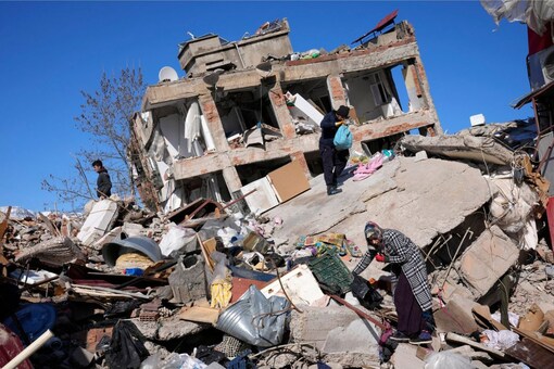 People search for their belongings at a collapsed building in Kahramanmaras, southern Turkey, Wednesday, Feb. 8, 2023. (Credits: AP)