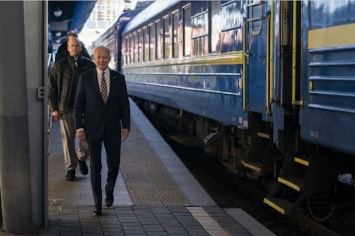 US President Joe Biden walks along the train platform after a surprise visit to meet with Ukrainian President Volodymyr Zelenskyy, in Kyiv on February 20, 2023. (AFP)
