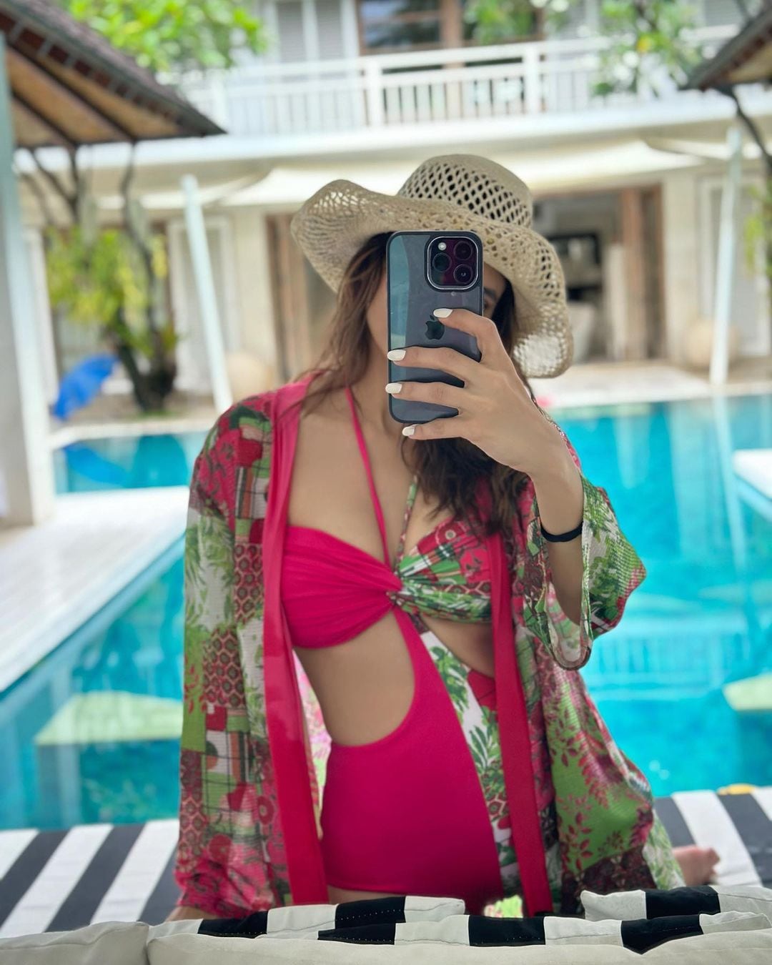 Aamna Sharif looks stylish in a pink cutout swimsuit.