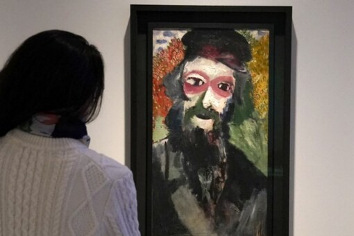 A visitor looks at Le Père (1911), a painting by Russian-born French artist Marc Chagall, at the Jewish Museum in New York City (Image: Reuters)