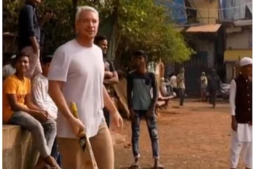 Diplo played cricket with local kids.