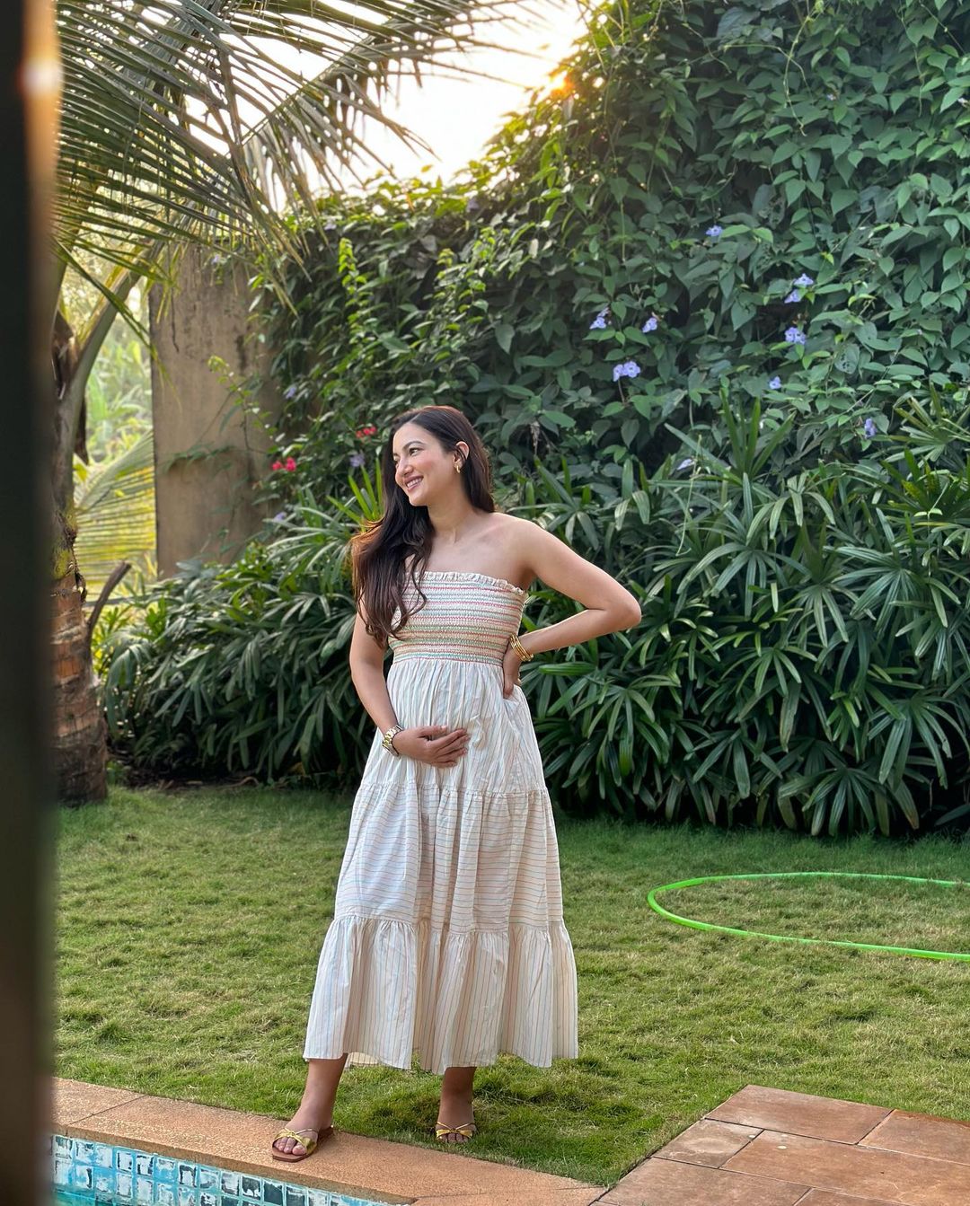 Gauahar Khan looks pretty as she flaunts her baby bump in a simple cotton dress.