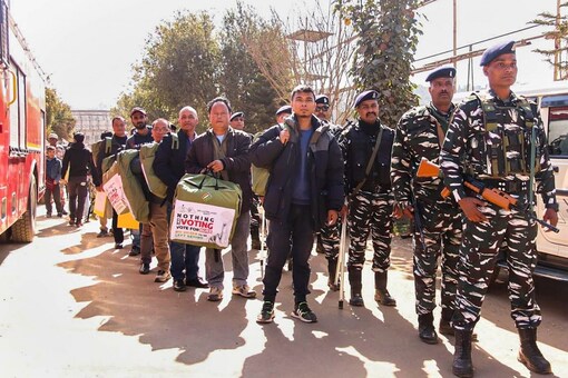 East Khasi Hills: Polling team accompanied by security personnel ready to leave dispatch centres ahead of Meghalaya Assembly elections, in East Khasi Hills, Sunday. (PTI Photo)