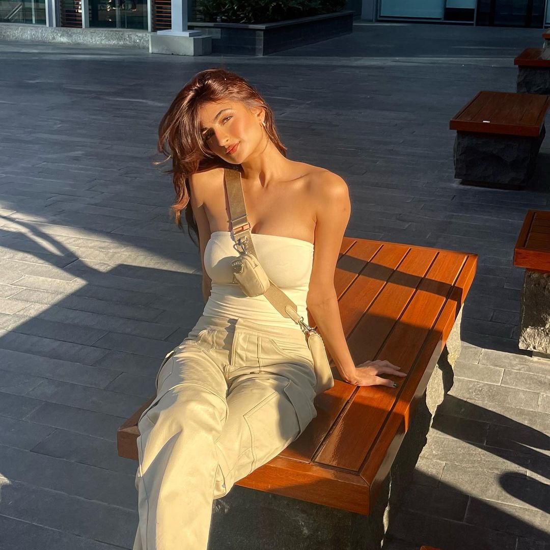 Palak Tiwari looks hot in a white bandeau top and matching pants. 