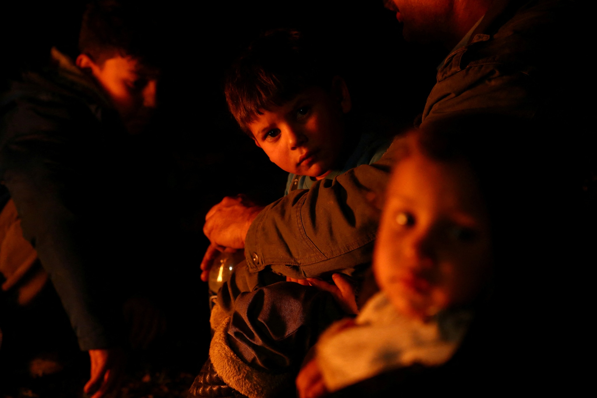 Rescuers in Turkey and Syria dug with their bare hands through the freezing night Tuesday hunting for survivors among the rubble of thousands of buildings felled in a series of violent earthquakes.
The confirmed death toll across the two countries has soared above 4,300 after a swarm of strong tremors near the Turkey-Syria border -- the largest of which measured at a massive 7.8-magnitude.
Children gather around a bonfire following an earthquake in Kahramanmaras, Turkey February 6, 2023. REUTERS/Cagla Gurdogan
Rescuers in Turkey and Syria dug with their bare hands through the freezing night Tuesday hunting for survivors among the rubble of thousands of buildings felled in a series of violent earthquakes.
The confirmed death toll across the two countries has soared above 4,300 after a swarm of strong tremors near the Turkey-Syria border -- the largest of which measured at a massive 7.8-magnitude.
Children gather around a bonfire following an earthquake in Kahramanmaras, Turkey February 6, 2023. REUTERS/Cagla Gurdogan