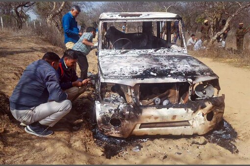 Charred remains of a vehicle where bodies of two Muslim men were found, at Loharu in Bhiwani district, Haryana. (Image: PTI)