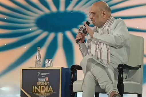 At the News18 Rising India Summit 2023, Union home minister Amit Shah said everybody is fighting against each other, but when it comes to standing against PM Modi, all Opposition leaders come together. (Photo: News18)