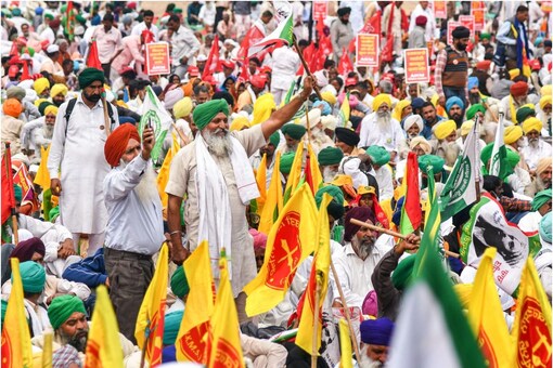Farmers under the banner of Samyukt Kisan Morcha (SKM) during 'Kisan Mahapanchayat', at Ramlila Maidan in New Delhi, Monday, March 20, 2023. (PTI Photo)