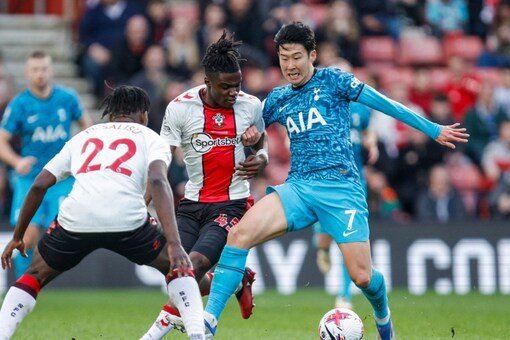 Tottenham's Son Heung-min, right, and Southampton's Romeo Lavia, center, compete for the ball during the English Premier League soccer match between Southampton and Tottenham at St Mary's Stadium in Southampton, England, Saturday, March 18, 2023. (AP Photo/David Cliff)