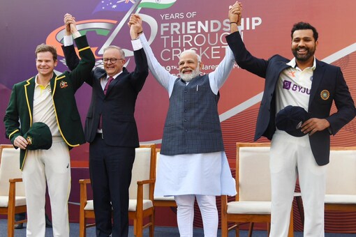 PM Modi triggered a loud roar when he raised the arms of the two captains in unison and gave a moment of the day to the photographers 