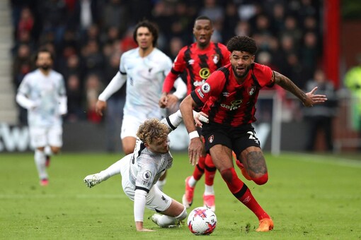 Bournemouth's Philip Billing gets past Liverpool's Harvey Elliott, left, during the English Premier League soccer match at the Vitality Stadium, Bournemouth, England, Saturday March 11, 2023. (Kieran Cleeves/PA via AP)