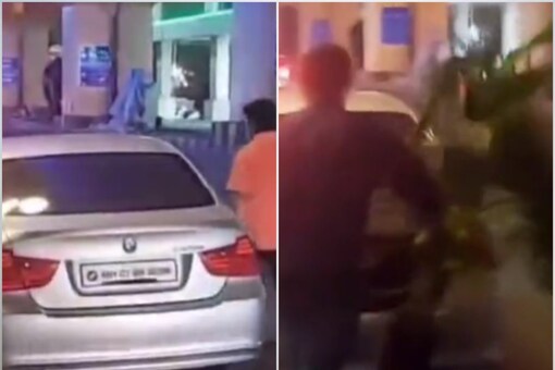 Nagpur viral video: The men came in a BMW and lifted some plants placed on the roadside for G-20 event. (Photo: Screen grab from video on Twitter)