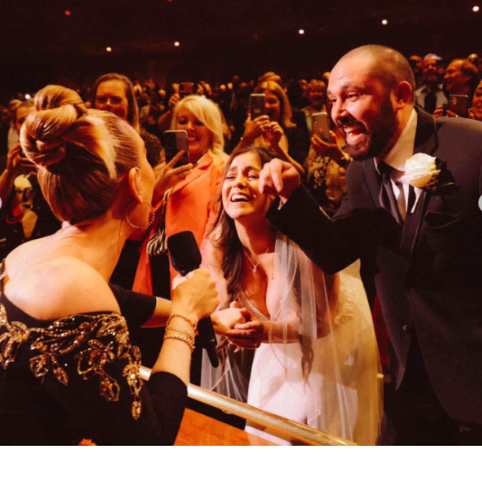 Viral Clip Shows Adele Signing Bride's Gown Mid-Concert