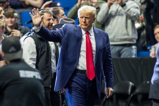 Former President Donald Trump waves to the crowd before the NCAA D1 Wrestling Championships at the BOK Center (Image: Reuters/USA Today)