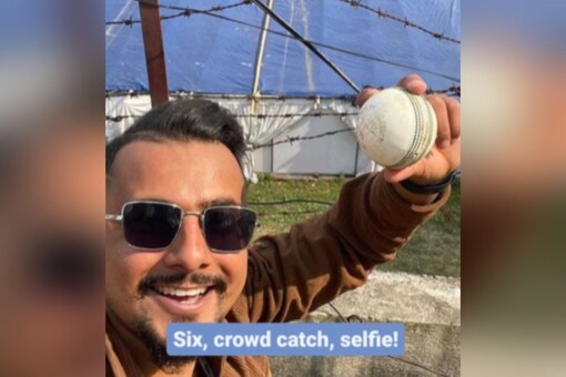 Spectator taking selfie with the ball after taking a catch during the UAE vs PNG match. (Instagram/icc and cricketworldcup)