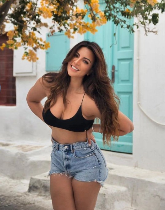 Shama Sikander looks pretty in a black bra and blue denim shorts. (Image: Instagram) Shama Sikander looks pretty in a black bra and blue denim shorts.