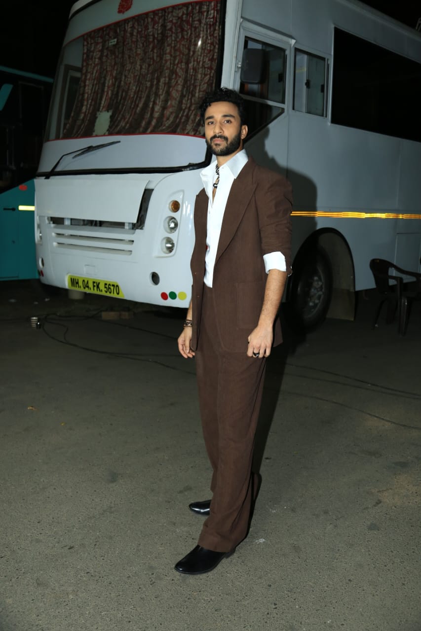 Raghav Juyal looks dapper in a brown pantsuit.
