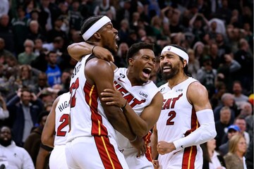 Milwaukee Bucks' Giannis Antetokounmpo fouls Miami Heat's Bam