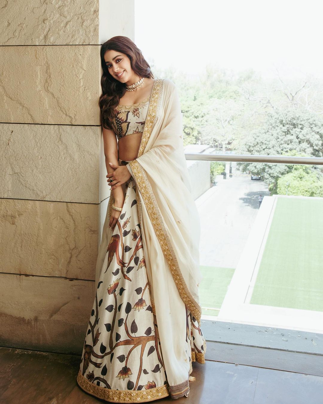 Janhvi Kapoor exudes elegance in a white lehenga with floral details.