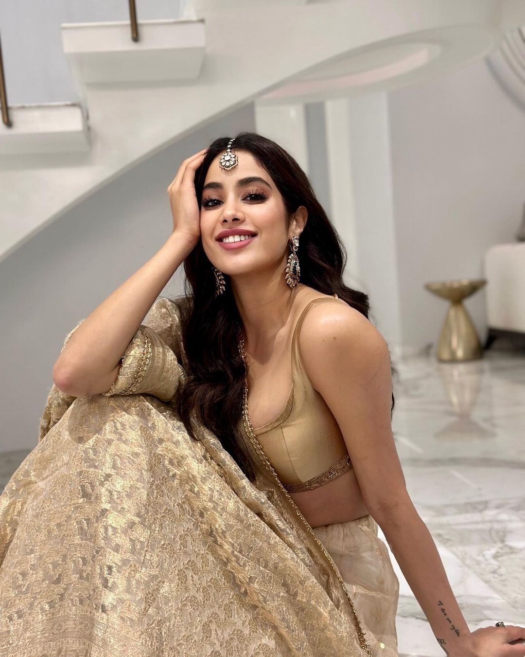 Janhvi Kapoor gives regal vibes in a golden lehenga. 