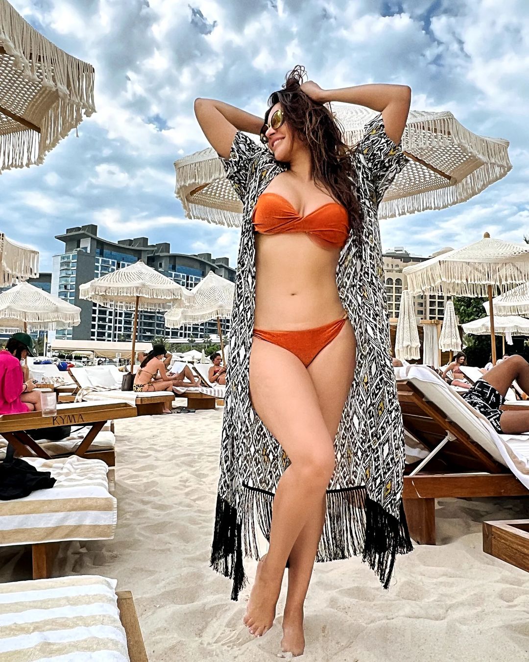 Shama Sikander displays her toned figure in a brown bikini. 