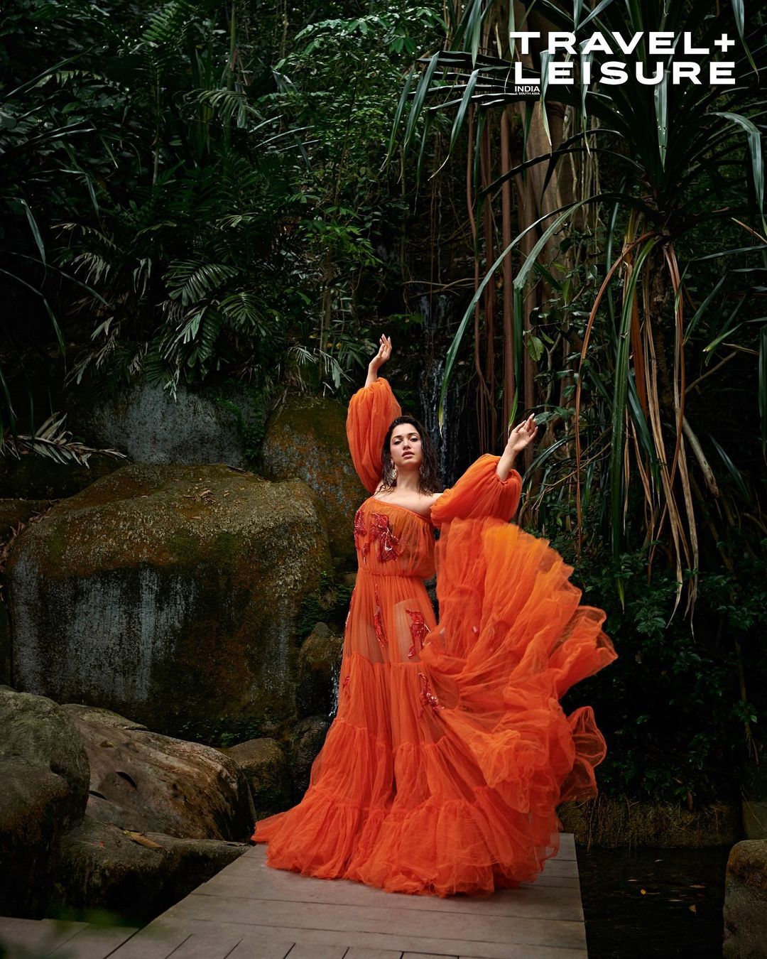 Tamannaah Bhatia looks flamboyant in an orange tulle gown with matching bikini underneath. 